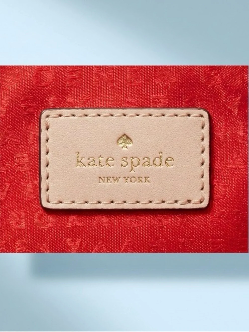 kate spade Cream Quilted Wristlet Clutch with Gold Logo